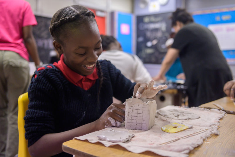 A picture of a young girl making art at ICA Miami.