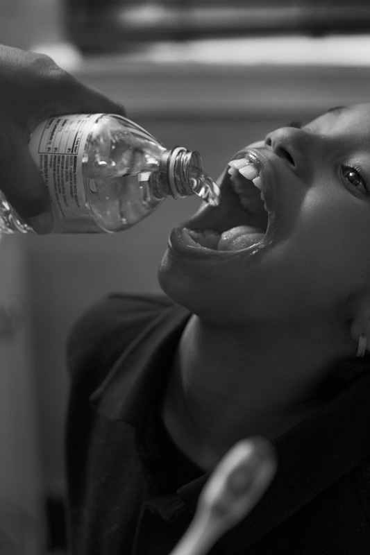 LaToya Ruby Frazier, Shea brushing Zion’s teeth with bottled water un her bathroom, 2016/2017 LaToya Ruby Frazier, Shea brushing Zion’s teeth with bottled water un her bathroom, 2016/2017